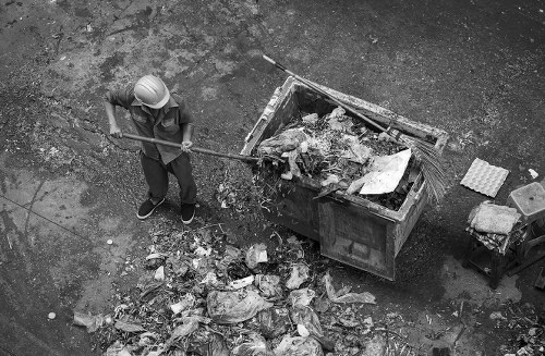 Waste crew sorting commercial recycling bins on Limehouse street