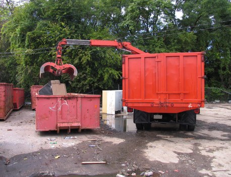 Front view of Limehouse area showing waste collection vehicles and accessible signage